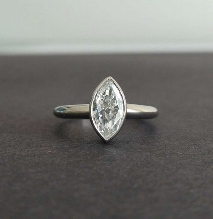 Vintage 1.00ct Marquise Cut Diamond Solitaire Ring, mounted in a new simple rub over platinum setting, colour D, clarity VS2, unique engagement ring