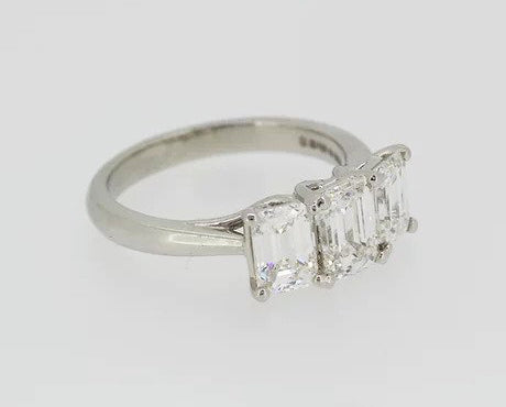 Emerald Cut 2.46ct Diamond Three Stone Ring in Platinum; a striking trilogy ring featuring three emerald-cut diamonds, 2.46 carats, Colour 'H', Clarity 'VS'