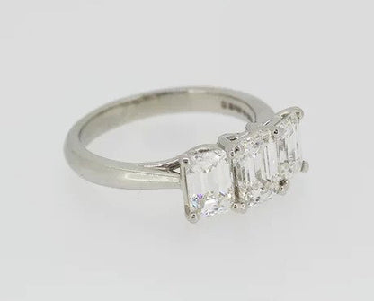 Emerald Cut 2.46ct Diamond Three Stone Ring in Platinum; a striking trilogy ring featuring three emerald-cut diamonds, 2.46 carats, Colour 'H', Clarity 'VS'