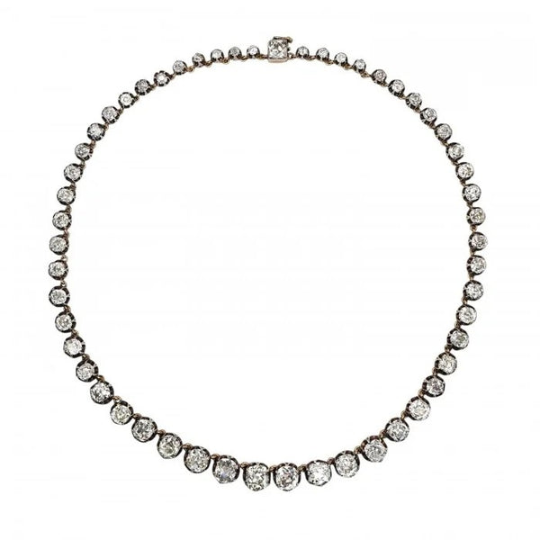 Victorian Antique 40cts Old Cut Diamond Line Riviere Necklace, 54 old-cut diamonds totalling 40 carats in silver-upon-gold crown claw settings. Late 19th century Circa 1880