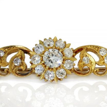 Vintage Diamond Floral Cluster Bar Brooch; featuring three floral clusters and diamond set leaf swirls, 2.55 carat total, Circa 1970s