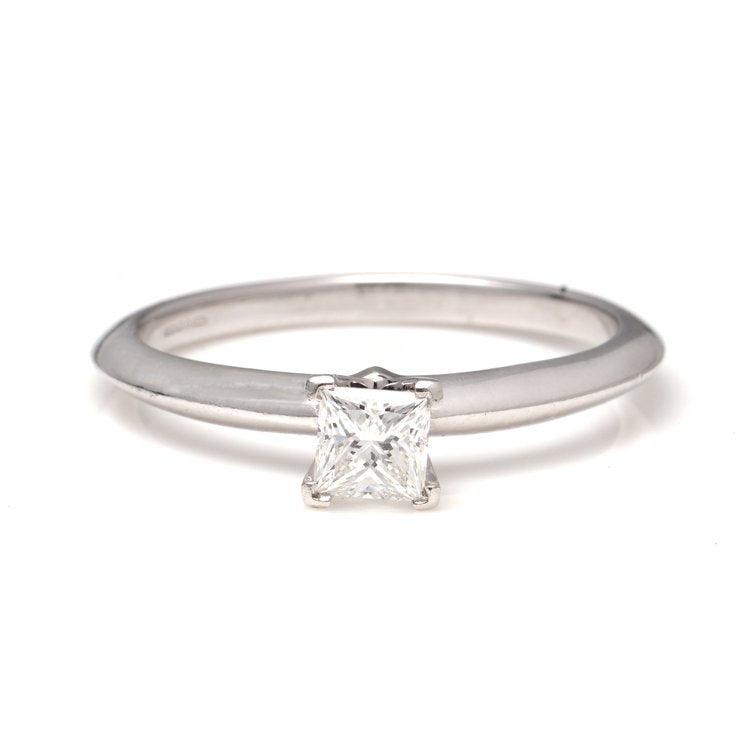 Tiffany and Co Princess Cut Diamond Solitaire Engagement Ring; platinum engagement ring set with 0.39ct square-cut diamond. Comes with original box and certificate