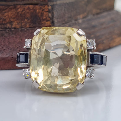 Vintage 1940s Retro 16cts Cushion Cut Yellow Sapphire Ring with Blue Sapphire and Diamond Shoulders in Platinum