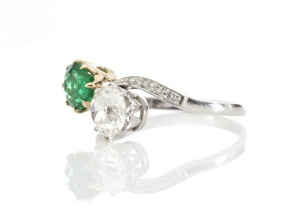 Natural Colombian Emerald and Diamond Crossover Ring in Platinum; set with 1.00ct natural emerald and 1.50ct old cut diamond, diamond set shoulders