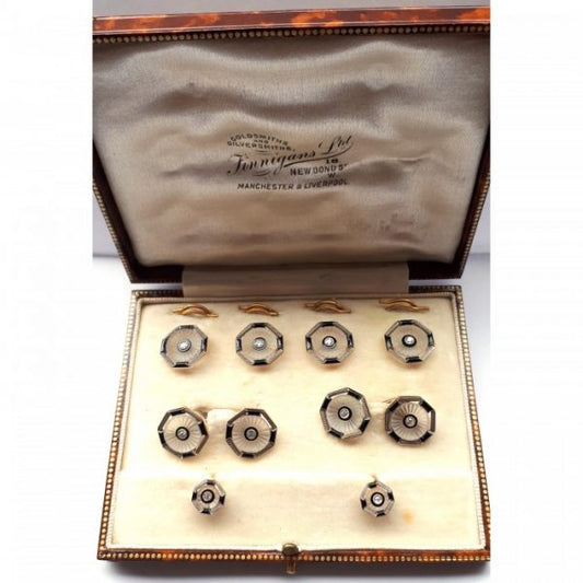Antique Edwardian Old Cut Diamond, Rock Crystal, Onyx and Enamel Dress Set in platinum and gold; consisting of four buttons with separate split rings, a pair of cufflinks with white gold carabiner links and a pair of shirt studs, with screw fittings. Circa 1910. Stamped 18, with invoice number 176/10. Comes in an original Finnigans of New Bonds Street fitted case