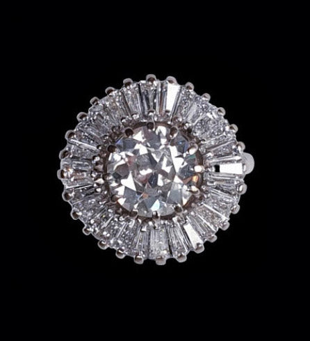 Old Cut Diamond Ballerina Cluster Ring; central 1.80 carat old European-cut diamond surrounded by 1.50 carats of tapering baguette-cut diamonds