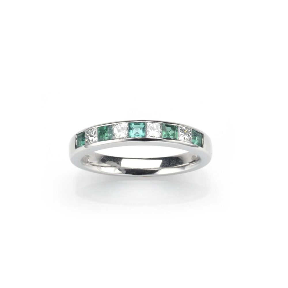 Emerald and diamond half eternity ring