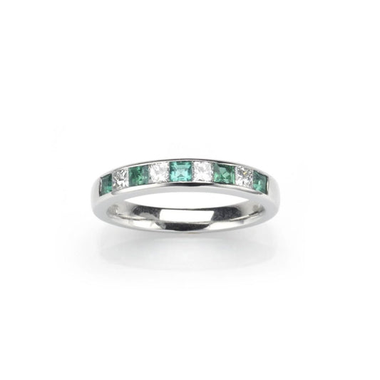 Emerald and diamond half eternity ring