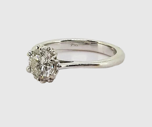 Diamond Solitaire Engagement Ring; A traditional diamond engagement ring, 0.85cts, claw-set, in 18ct white gold.