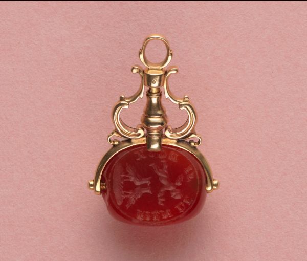 18th Century Carnelian Intaglio and 18ct Gold Triple Seal; with three intaglios: two feature profiles, one features an angel, two doves and text from Don Juan quote by Molière