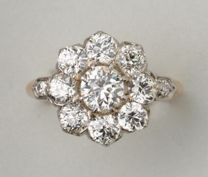 Antique Edwardian Old Cut Diamond Floral Cluster Ring; set with 2.75 carats of old-cut diamonds, in 18ct gold and platinum, Made in France, Circa 1910