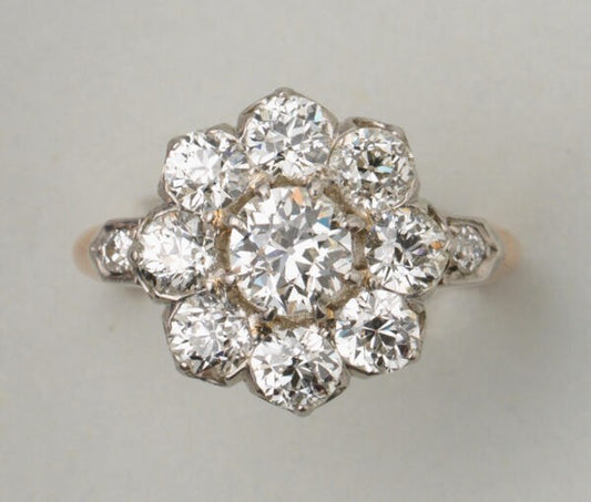 Antique Edwardian Old Cut Diamond Floral Cluster Ring; set with 2.75 carats of old-cut diamonds, in 18ct gold and platinum, Made in France, Circa 1910