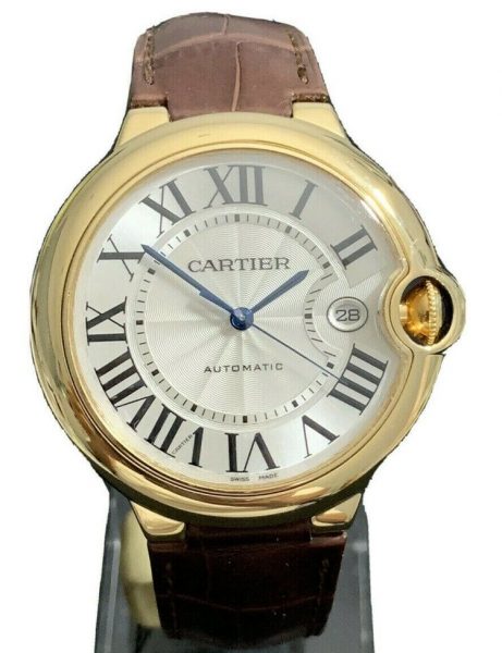 Cartier Ballon Bleu 18ct Yellow Gold 42mm Automatic; model 2998, silver guilloche dial with Roman numerals, blue steel hands, date indicator, sapphire crystal and sapphire cabochon crown, on a Cartier brown leather strap with an 18ct yellow gold Cartier deployant buckle, Year 2011, with Cartier box and papers.