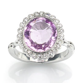 Antique edwardianCluster ring set with an oval baby pink topaz estimated to weigh 3 carat