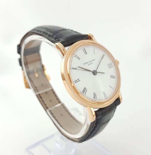 Patek Philippe 3802R Calatrava 18ct Rose Gold 33mm Automatic watch, porcelain-white dial, black Roman numerals, date aperture at 3, Patek Philippe black leather strap, Circa 1994, mint condition, with Patek Philippe pouch and Extract.