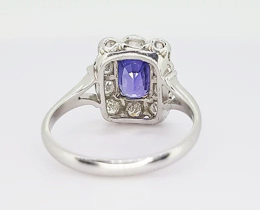 2.16ct Natural Sapphire and Diamond Cluster Ring; 2.16 carat cushion-shaped natural sapphire, surrounded by 0.98cts diamonds, in 18ct white and yellow gold