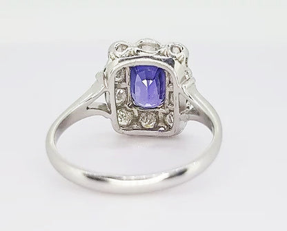 2.16ct Natural Sapphire and Diamond Cluster Ring; 2.16 carat cushion-shaped natural sapphire, surrounded by 0.98cts diamonds, in 18ct white and yellow gold