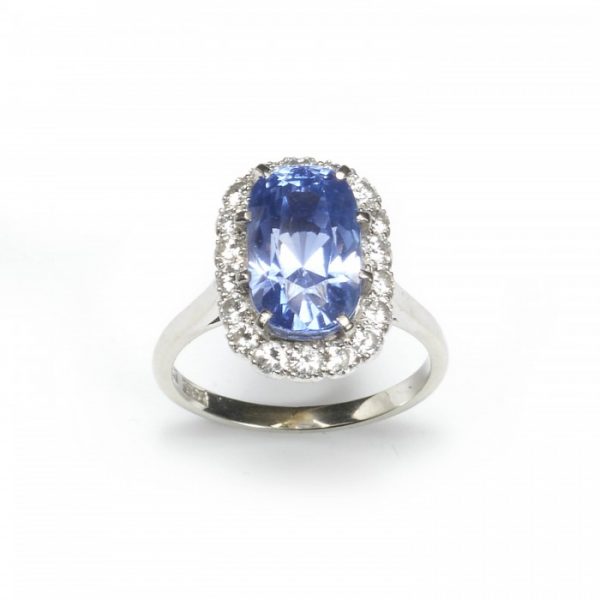 7.27ct Natural Sapphire and Diamond Cluster Ring in Platinum, Certified 7.27 carat oval-shaped cushion-cut Madagascan sapphire surrounded by round brilliant-cut diamonds, with a GCS certificate