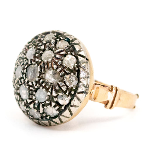 A rose cut diamond cluster ring in gold and silver