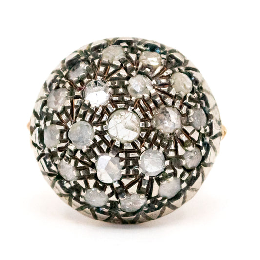 A rose cut diamond cluster ring in gold and silver