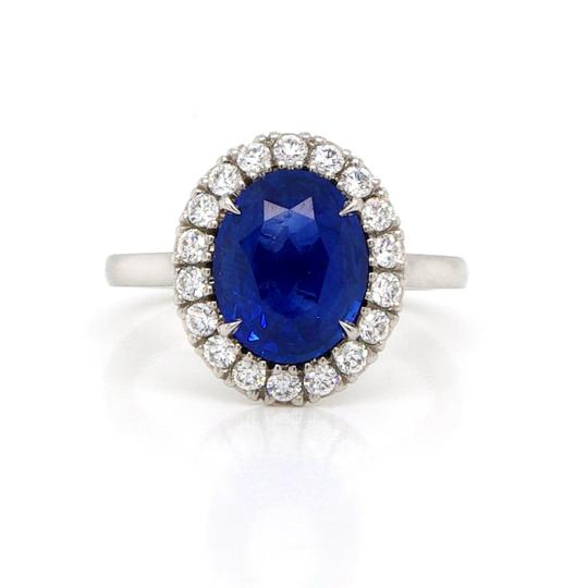 Sapphire, Diamond and Platinum Oval Cluster Ring; 2.77ct oval faceted sapphire cluster ring surrounded by 0.40cts brilliant cut diamonds