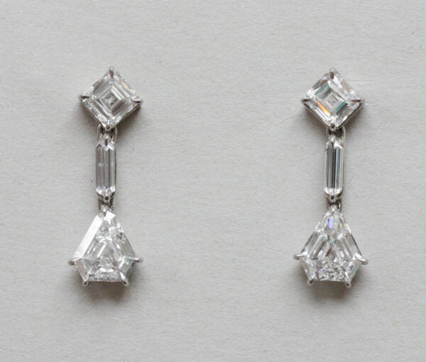 Art Deco 3.40ct Diamond Drop Earrings; comprising of asscher-cut, baguette-cut and kite or shield cut diamonds. Mounted in white gold. England, circa 1930.