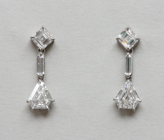 Art Deco 3.40ct Diamond Drop Earrings; comprising of asscher-cut, baguette-cut and kite or shield cut diamonds. Mounted in white gold. England, circa 1930.