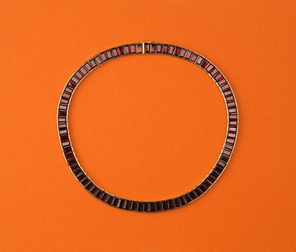 Vintage French Baguette Garnet Collar Necklace by Poiray, 18ct yellow gold necklace set with 79 tapered baguette cut garnets, Signed and numbered, Circa 1985