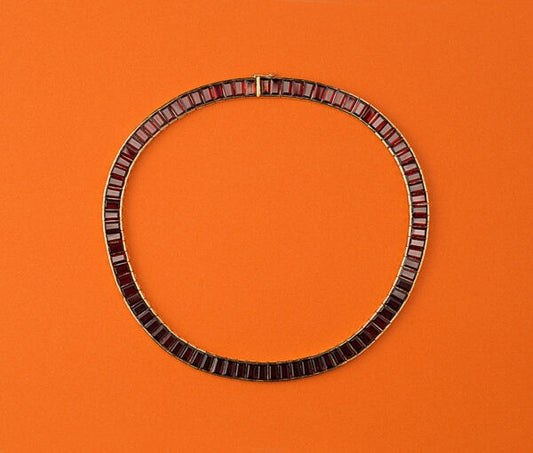 Vintage French Baguette Garnet Collar Necklace by Poiray, 18ct yellow gold necklace set with 79 tapered baguette cut garnets, Signed and numbered, Circa 1985