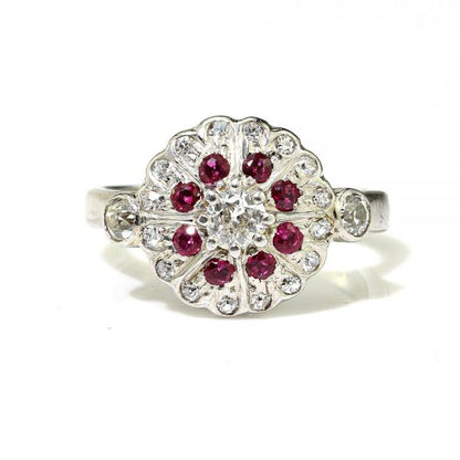 Vintage Ruby and Diamond Cluster Dress Ring in 18ct White Gold; set with 0.50cts round brilliant-cut diamonds and 0.24cts round faceted rubies. Made in England, Circa 1994