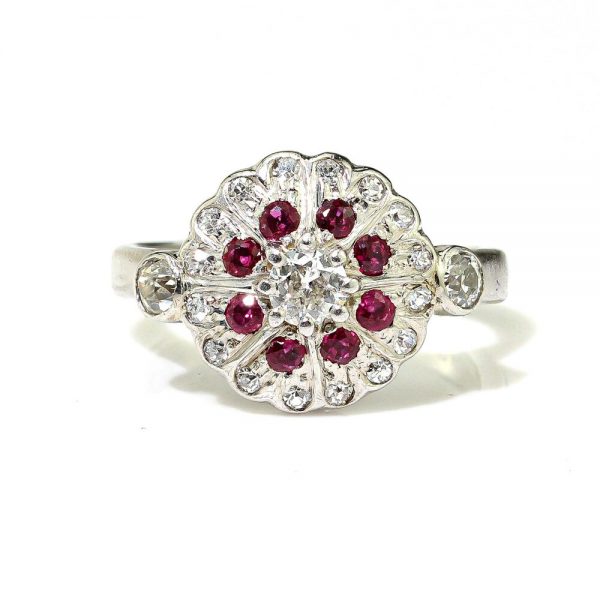 Vintage Ruby and Diamond Cluster Dress Ring in 18ct White Gold; set with 0.50cts round brilliant-cut diamonds and 0.24cts round faceted rubies. Made in England, Circa 1994