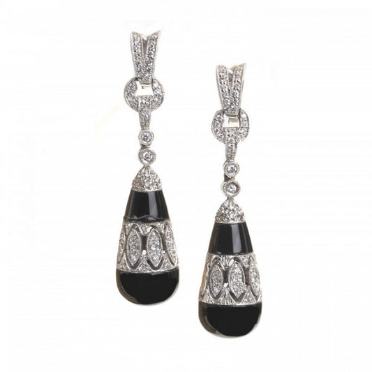 Black Onyx and Diamond Drop Earrings; torpedo-shaped black onyx drops, with diamond-set cut-out mid-section and suspended by diamond links, in 18ct white gold