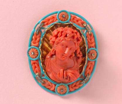 18th Century Carved Coral Cameo Brooch of Bacchante, a follower of Bacchus, framed by carved coral knots, rose-cut diamond ribbons and carved coral flowers