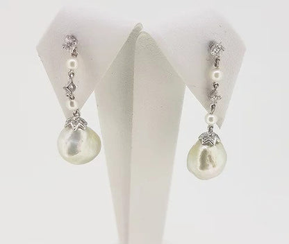 South Sea Pearl and Diamond Drop Earrings; featuring South Sea pearls suspended from a pearl and diamond drop, mounted in 18ct white gold