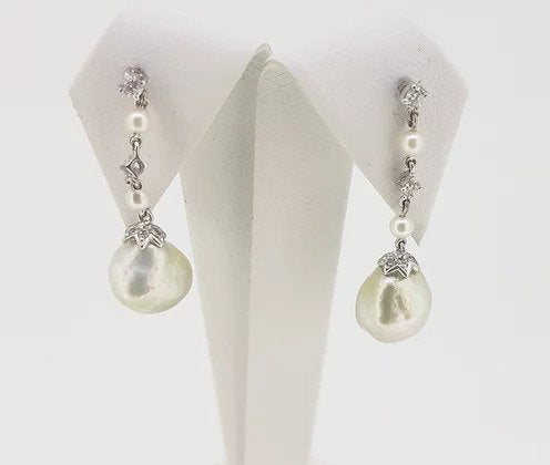South Sea Pearl and Diamond Drop Earrings; featuring South Sea pearls suspended from a pearl and diamond drop, mounted in 18ct white gold