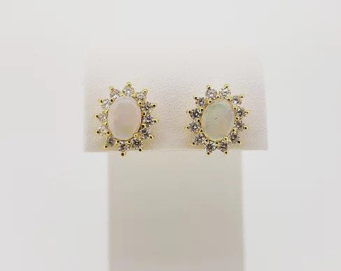 Opal and Diamond Oval Cluster Stud Earrings; 2.34cts oval cabochon opals surrounded by 1.06cts brilliant-cut diamonds, in 18ct yellow gold