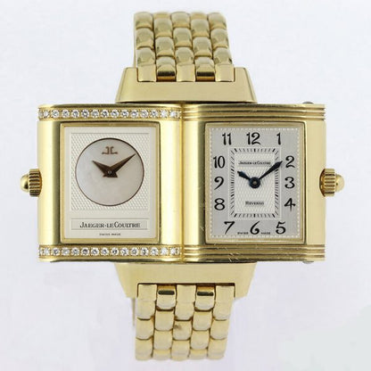 Jaeger LeCoultre Reverso Duetto 18ct Yellow Gold Watch; Ref. 266.1.44, with a 21mm 18ct yellow gold case with reversible dial, switching from silver colour with Arabic numerals to mother of pearl with diamonds running above and below the dial, on an 18ct yellow gold bracelet with hidden double-fold clasp, with Jaeger-LeCoultre box