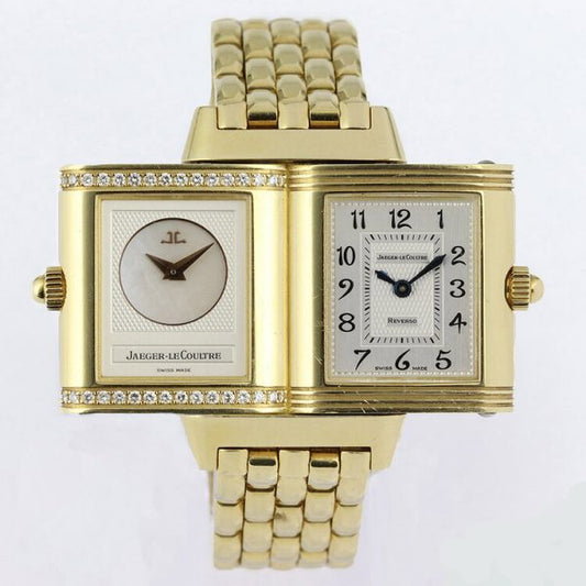 Jaeger LeCoultre Reverso Duetto 18ct Yellow Gold Watch; Ref. 266.1.44, with a 21mm 18ct yellow gold case with reversible dial, switching from silver colour with Arabic numerals to mother of pearl with diamonds running above and below the dial, on an 18ct yellow gold bracelet with hidden double-fold clasp, with Jaeger-LeCoultre box