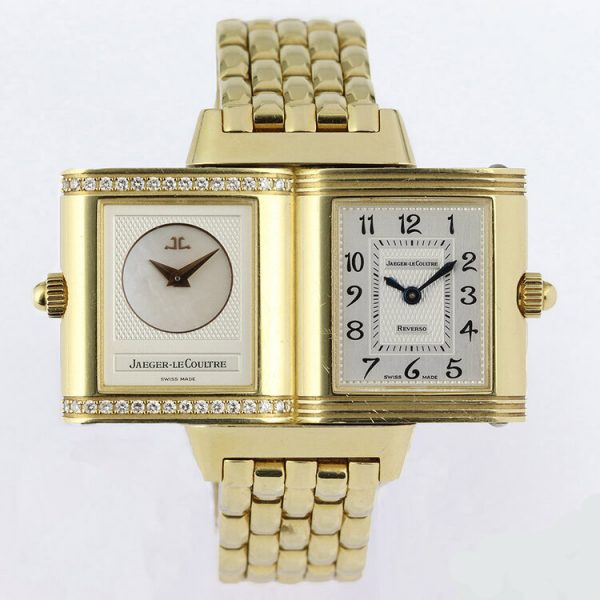 Jaeger LeCoultre Reverso Duetto 18ct Yellow Gold Watch; Ref. 266.1.44, with a 21mm 18ct yellow gold case with reversible dial, switching from silver colour with Arabic numerals to mother of pearl with diamonds running above and below the dial, on an 18ct yellow gold bracelet with hidden double-fold clasp, with Jaeger-LeCoultre box