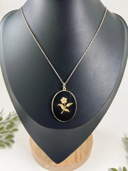 Edwardian 18 Carat Yellow Gold Onyx and Seed Pearl Flower Locket, Circa 1900