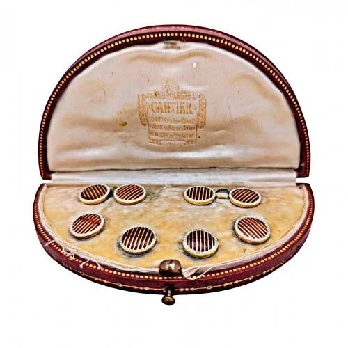 Cartier Art Deco Enamel and Gold Cufflinks Dress Set, circular pair of cufflinks and four buttons with red guilloche enamel and gold stripes and white dot enamel borders. In original Cartier red morocco case, Circa 1930