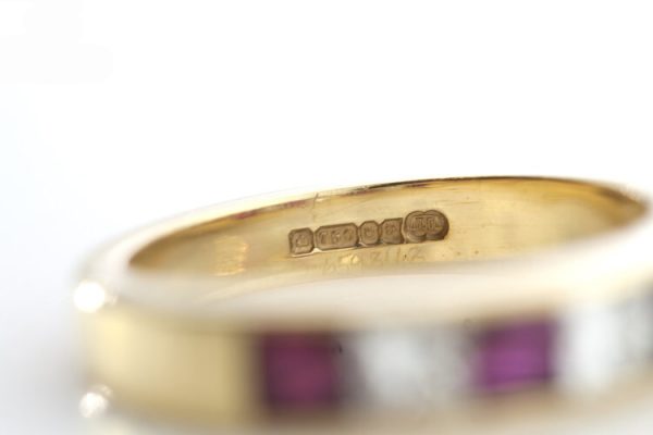 Garrard Princess Cut Ruby and Diamond Half Eternity Ring, 0.64ct princess-cut rubies and 0.48cts princess-cut diamonds, in 18ct Yellow Gold