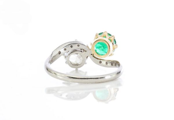 Natural Colombian Emerald and Diamond Crossover Ring in Platinum; set with 1.00ct natural emerald and 1.50ct old cut diamond, diamond set shoulders