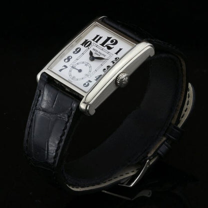 Patek Philippe 18ct White Gold Manual Winding Watch; 29mm 18ct white gold case with white porcelain dial and black Arabic hour markers, on an original Patek Philippe leather strap with an 18ct white gold Patek Philippe buckle, with certificate and Patek Philippe travel pouch