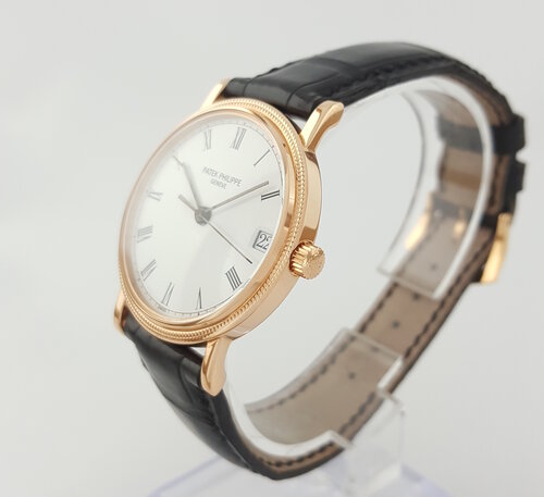 Patek Philippe 3802R Calatrava 18ct Rose Gold 33mm Automatic watch, porcelain-white dial, black Roman numerals, date aperture at 3, Patek Philippe black leather strap, Circa 1994, mint condition, with Patek Philippe pouch and Extract.