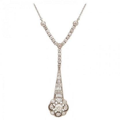 Edwardian Style Old Cut Diamond Floral Cluster Drop Pendant; old-cut diamonds set in an openwork floral cluster drop, suspended from a row of collet set diamonds, 1.00 carat total, mounted in platinum, on an integrated trace chain