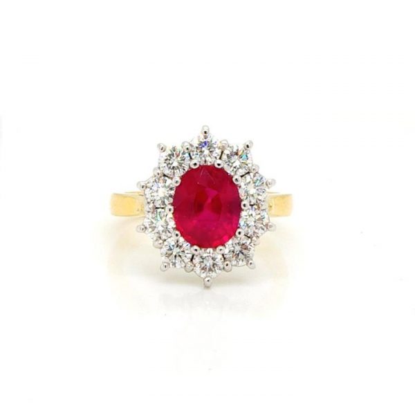 Ruby and Diamond Oval Cluster Ring; central 2.02ct oval faceted ruby within a surround of 1.25cts brilliant cut diamonds, in 18ct yellow gold