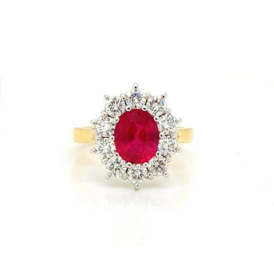Ruby and Diamond Oval Cluster Ring; central 2.02ct oval faceted ruby within a surround of 1.25cts brilliant cut diamonds, in 18ct yellow gold