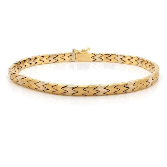 Bi Colour 18ct Gold Curb Link Bracelet; 18ct yellow and white gold curb link bracelet with fold over safety clasp. Measuring 19cm in length