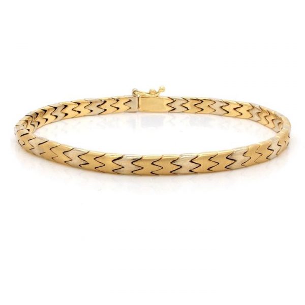 Bi Colour 18ct Gold Curb Link Bracelet; 18ct yellow and white gold curb link bracelet with fold over safety clasp. Measuring 19cm in length
